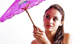 Fedra toying her cunt with a purple parasol