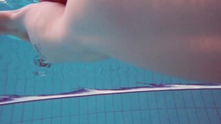 Half euro sexy girl taking swimming classes in public pool