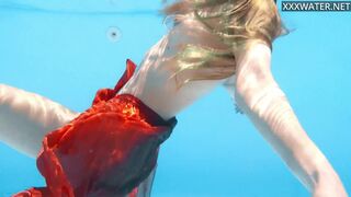 Petite teen Ivi Rein endures the free naked swimming