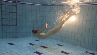 See a pretty Russian teen Nastya underwater